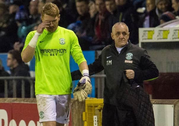 Hibs goalkeeper Mark Oxley was substituted after losing a contact lens. Picture: Craig Foy/SNS