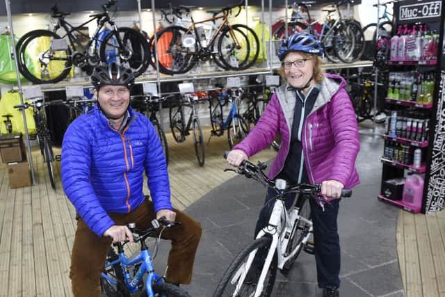 Chris Tiso and his mother Maude prepare to welcome customers at the Leith store. Picture: Greg Macvean