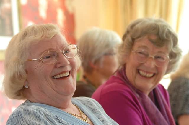 Ladies laughing at a Contact the Elderly tea party. Picture: Contributed.