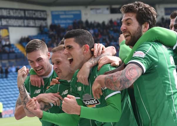 Celtic's Tom Rogic (2nd right) celebrates his excellent winning goal at the weekend. Picture: SNS