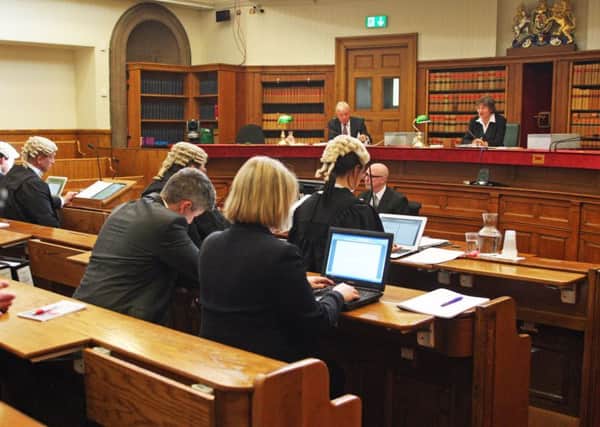 Certain court officials must wear robes and wigs, though judges in civil cases do not always do so. Picture: Lesley Donald