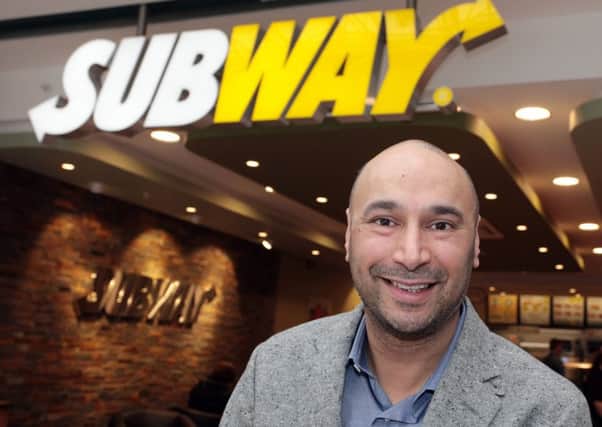Franchisee Haj Atwal at his new Subway branch in Livingston, the brand's 5,000th in Europe. Picture: Contributed