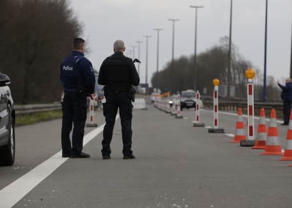 Police officers stand at the French-Belgian border following the Brussels terror attacks. Picture: Getty