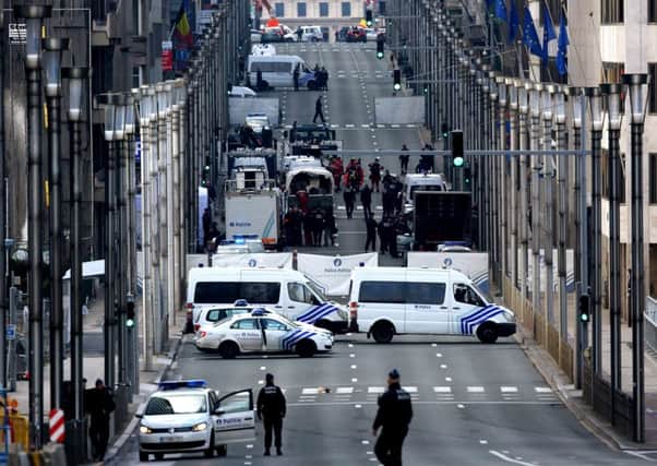 Soldiers and police officers patrol outside Maelbeek metro station following Tuesday's attacks. Picture: Getty