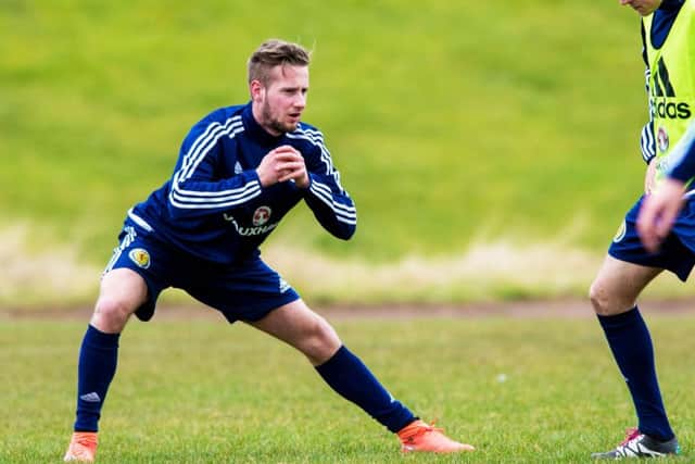 Scotland Under-21 winger Billy King prepares for tonight's match against France. Pic: SNS