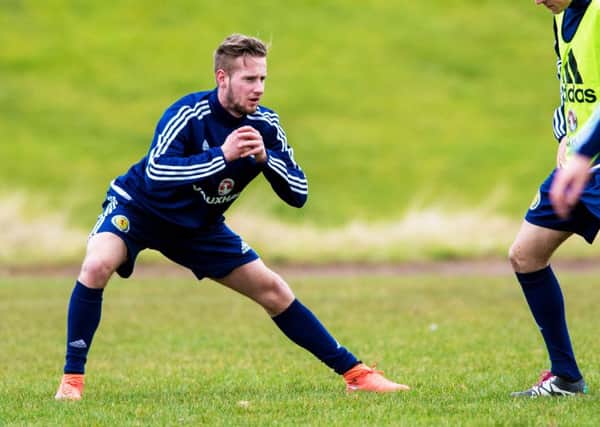 Scotland Under-21 winger Billy King prepares for tonight's match against France. Pic: SNS