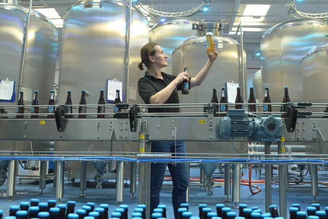 Kirsty Dunsmore raises a glass of the  Edinburgh Beer Factory's  first beer, Paolozzi lager. Picture: Jon Savage/TSPL