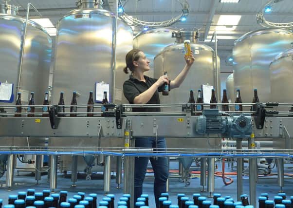 Kirsty Dunsmore raises a glass of the  Edinburgh Beer Factory's  first beer, Paolozzi lager. Picture: Jon Savage/TSPL