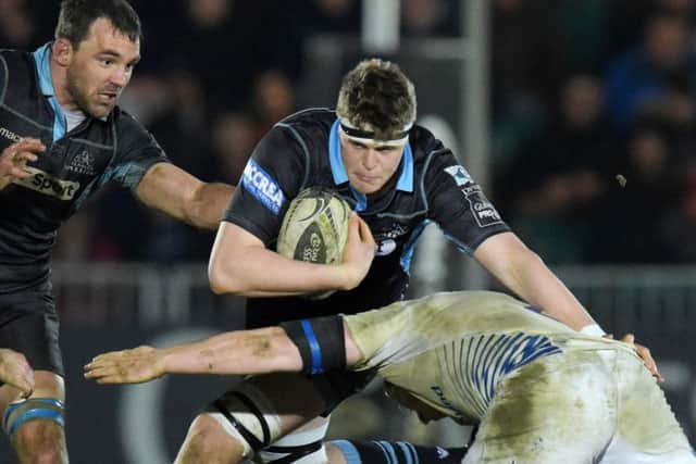 Glasgow Warriors' Scott Cummings (centre) will remain at the club for another three years. Picture: SNS