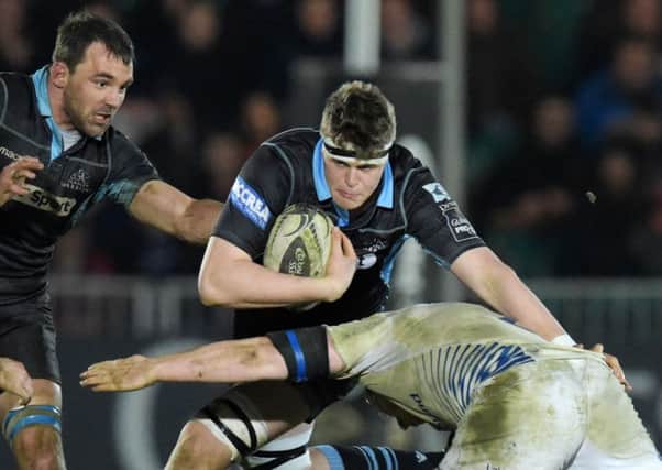Glasgow Warriors' Scott Cummings (centre) will remain at the club for another three years. Picture: SNS