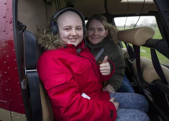 Megan Fletcher and her mother Shona Fletcher after arriving by helicopter.


Picture Ian Rutherford