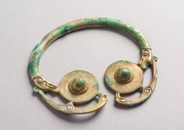 An ornate gold pin in the likeness of a bird found buried with a hoard of other treasures in a Galloway field. Picture: Contributed