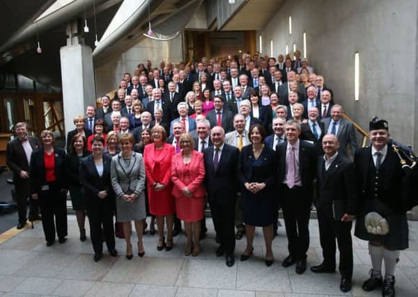 MSPs from all parties were piped out of Holyrood to  mark the end  of the session of Parliament. Picture: PA