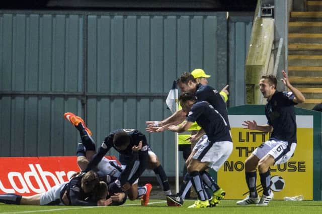 The Falkirk players celebrate after earning a terrific victory. Picture: SNS