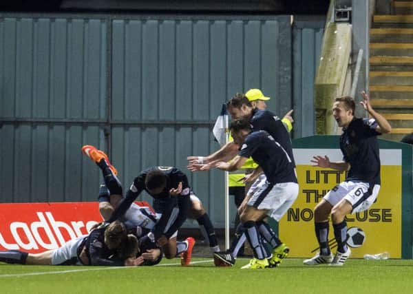 The Falkirk players celebrate after earning a terrific victory. Picture: SNS