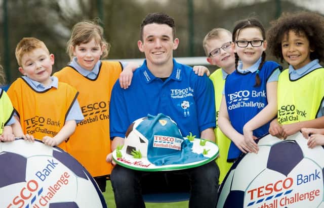 Scotland's John McGinn, centre, joins pupils at his old school, St Stephens Primary in Clydebank, to promote the Tesco Bank Football Challenge. Picture: SNS Group