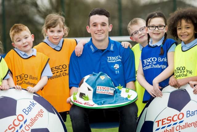 Scotland's John McGinn, centre, joins pupils at his old school, St Stephens Primary in Clydebank, to promote the Tesco Bank Football Challenge. Picture: SNS Group