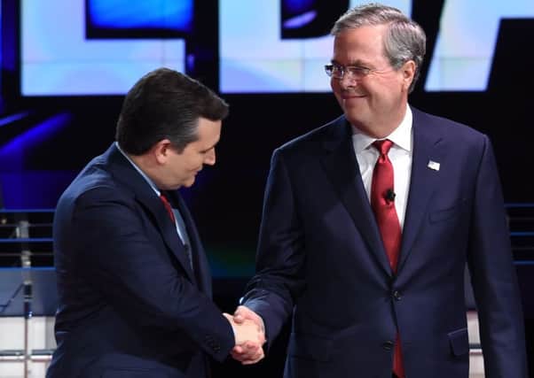 Republican presidential candidate Ted Cruz (left) shakes hands with Jeb Bush. Picture: AFP/Getty Images