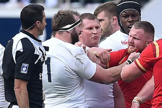 England's Joe Marler clashes with Wales' Samson Lee at Twickenham. Picture: Ben Stansall/AFP/Getty Images