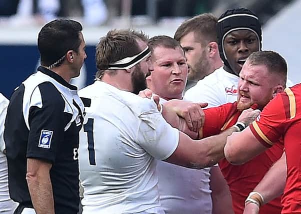 England's Joe Marler clashes with Wales' Samson Lee at Twickenham. Picture: Ben Stansall/AFP/Getty Images