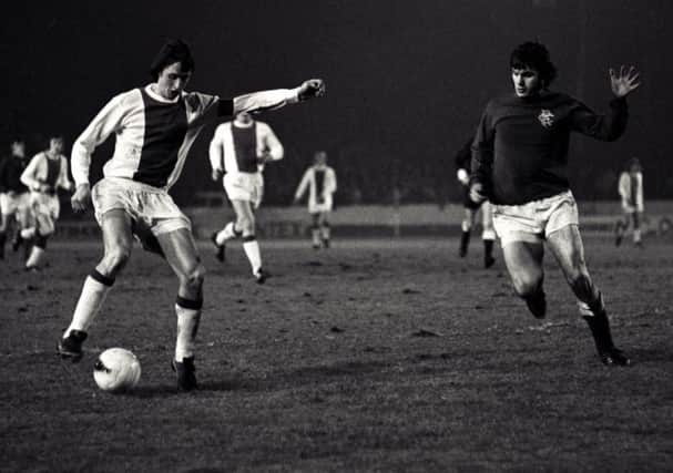Ajax forward 
Johan Cruyff, left, is shadowed by Rangers' Derek Johnstone during the 1973 Super Cup final first leg at Ibrox. Picture: SNS Group