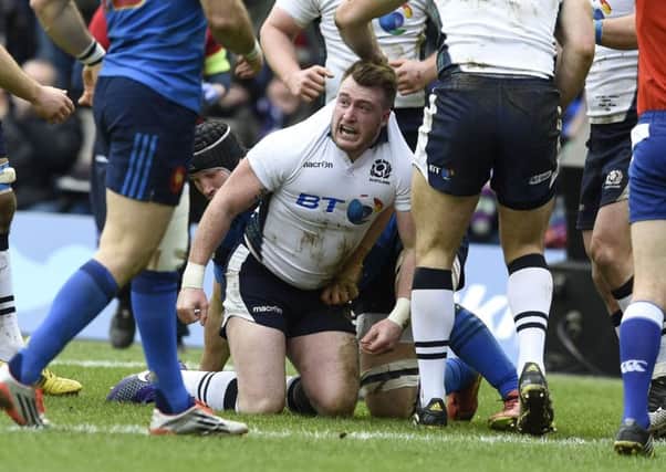 Stuart Hogg celebrates after scoring Scotland's first try against France. Picture: Ian Rutherford