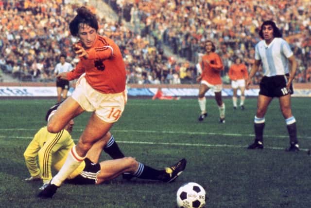 Dutch forward Johan Cruyff beats Argentina goalkeeper Daniel Carnevali on his way to scoring during the 1974 World Cup quarter-final in Gelsenkirchen. Picture: AFP/Getty Images