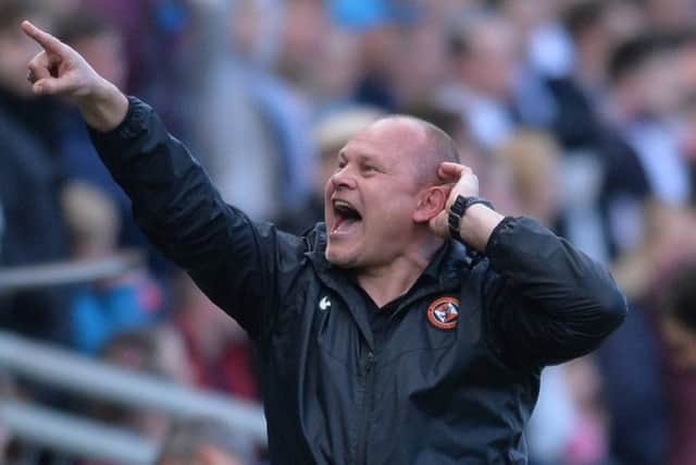 Dundee United manager Mixu Paatelainen has been charged for gesturing to the Dundee fans behind his dugout following United's late equaliser. Picture: Mark Runnacles/Getty Images