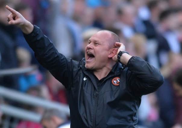 Dundee United manager Mixu Paatelainen has been charged for gesturing to the Dundee fans behind his dugout following United's late equaliser. Picture: Mark Runnacles/Getty Images