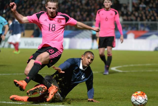 Scotland midfielder Billy King vies with France forward Sebastien Haller. Picture: Jean-Francois Monier/AFP/Getty Images