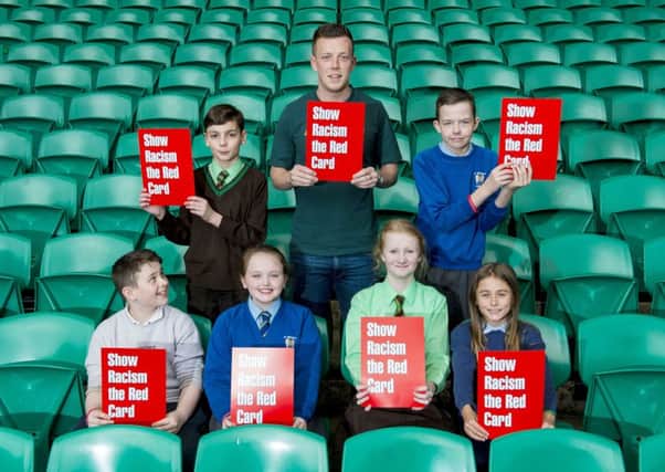 Callum McGregor shows racism the red card. Picture: SNS
