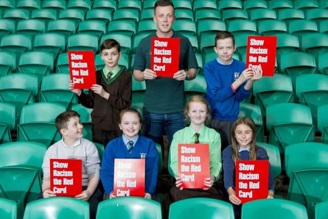 Callum McGregor shows racism the red card. Picture: SNS