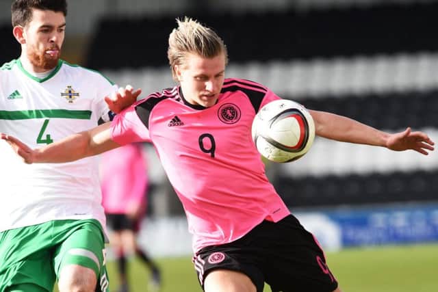 Hibs striker Jason Cummings missed a penalty and then twice scored for Scotland Under-21s. Pic: SNS
