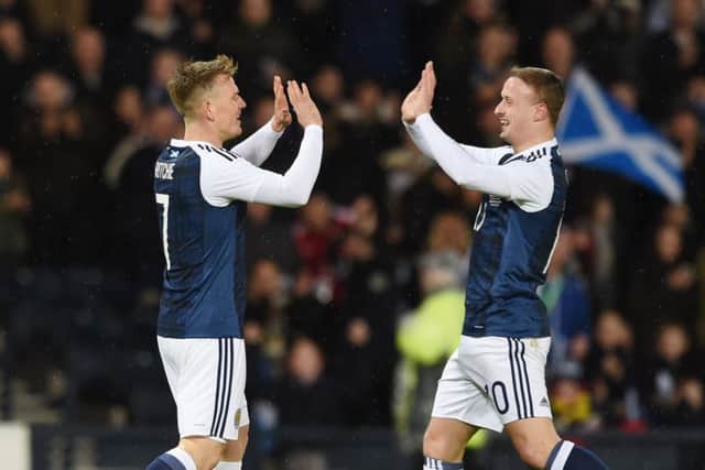 Scotland matchwinner Matt Ritchie, left, is congratulated by Leigh Griffiths after scoring the only goal against Denmark in a friendly at Hampden Park last night. Picture: SNS