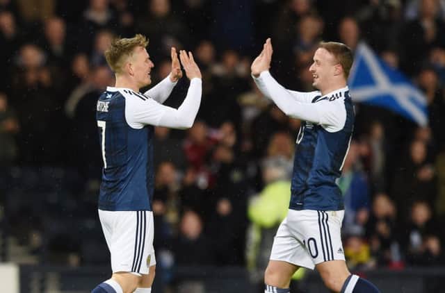 Scotland matchwinner Matt Ritchie, left, is congratulated by Leigh Griffiths after scoring the only goal against Denmark in a friendly at Hampden Park last night. Picture: SNS