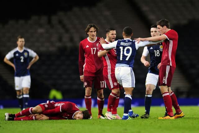 Players square up after Liam Bridcutt's tackle on Erik Sviatchenko. Picture: Michael Gillen