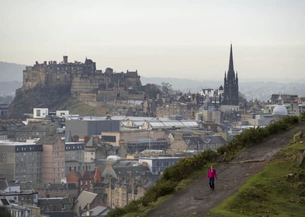 A walker on the Radical Road in Holyrood Park travels the route named in recognition of the labourers used to create it. Picture: Ian Rutherford