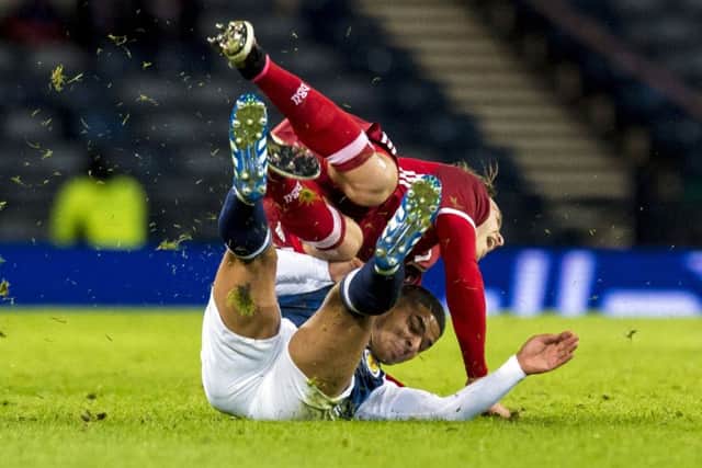 Scotland's Liam Bridcutt, right, challenges Danish defender Erik Sviatchenko of Celtic. Picture: Craig Williamson/SNS