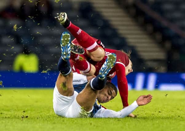 Scotland's Liam Bridcutt, right, challenges Danish defender Erik Sviatchenko of Celtic. Picture: Craig Williamson/SNS