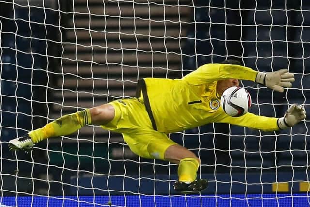 Scotland's Craig Gordon saves from Martin Braithwaite of Denmark during the International friendly at Hampden. Picture: Ian MacNicol/Getty