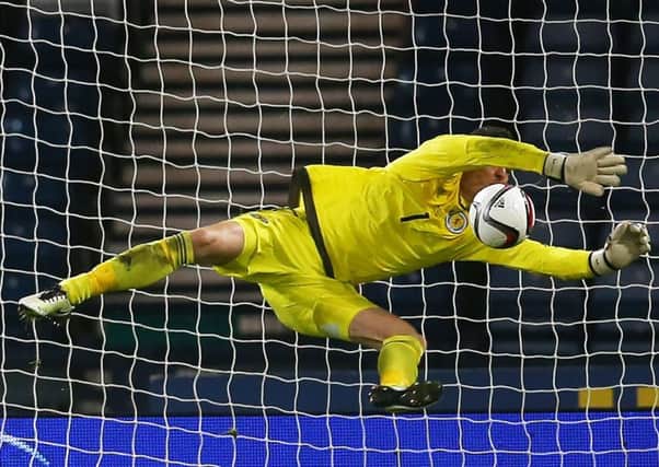 Scotland's Craig Gordon saves from Martin Braithwaite of Denmark during the International friendly at Hampden. Picture: Ian MacNicol/Getty