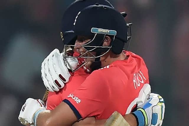 England's Jos Buttler, left, and Joe Root celebrate after winning their World T20 semi-final against New Zealand. Picture: Money Sharma/AFP/Getty