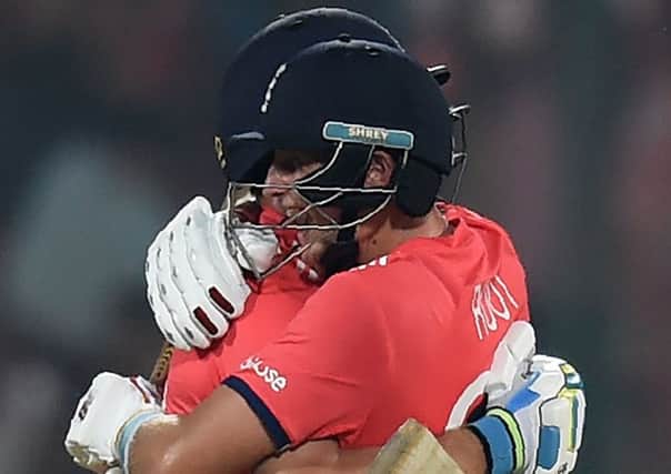England's Jos Buttler, left, and Joe Root celebrate after winning their World T20 semi-final against New Zealand. Picture: Money Sharma/AFP/Getty