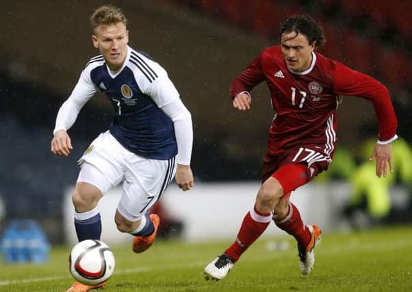 Scotland's Matt Ritchie, left, gets away from Denmark's Thomas Delaney during the friendly at Hampden. Picture: Danny Lawson/PA