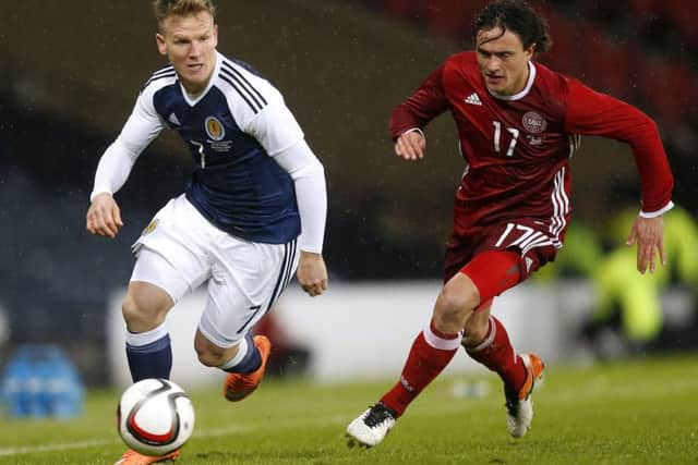 Scotland's Matt Ritchie, left, gets away from Denmark's Thomas Delaney during the friendly at Hampden. Picture: Danny Lawson/PA