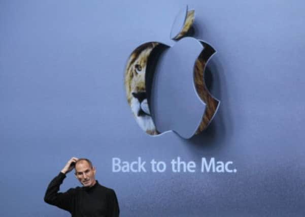 Steve Jobs, pictured wearing his trademark black turtleneck jumper, at an Apple special event in 2010. Picture: Getty Images
