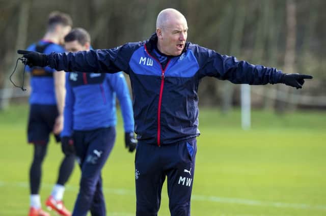 Mark Warburton directs his players in training as Rangers prepare for tomorrows trip to Starks Park. Picture: SNS