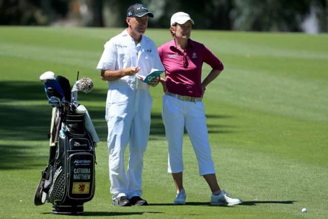 Catriona Matthew discusses a yardage with her caddie during the first round in California. Picture: Getty Images