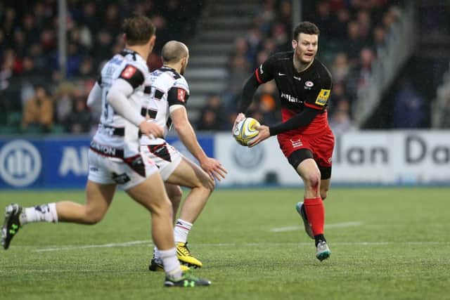 Duncan Taylor of Saracens prepares to pass during the Aviva Premiership match against Gloucester at Allianz Park in February.
Picture: Getty Images