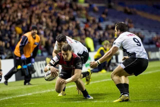 Damien Hoyland scores his second try as Edinburgh overcome a spirited Zebre side last night. Picture: SNS